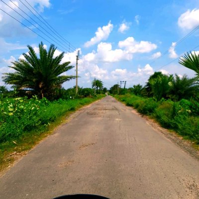ভগবানের তৈরি প্রকৃতির মাঝে মানুষের তৈরি বেহাল রাস্তা