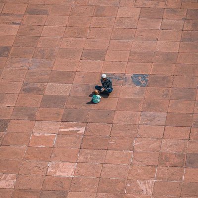 minimal photography of father and son in Jama Masjid,  Delhi