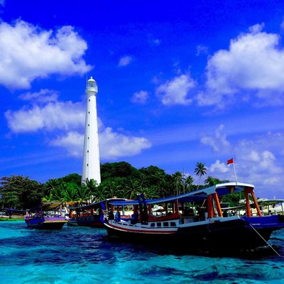 Sailing Boat Near Lighthouse on Lengkuas Island, Belitung