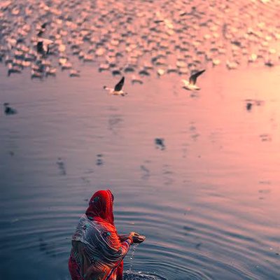 Offering water to Sun (Surya Arghya)