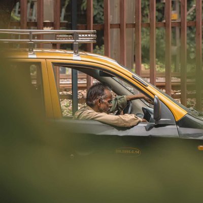 old man in taxi
