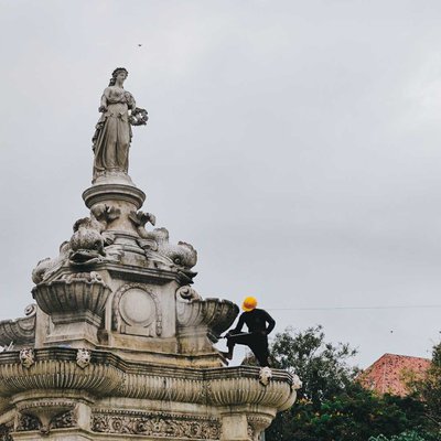 A Worker cleaning up the Beautiful Flora Fountain 