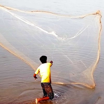 fisherman catching fish in river with fishing net 🥅
