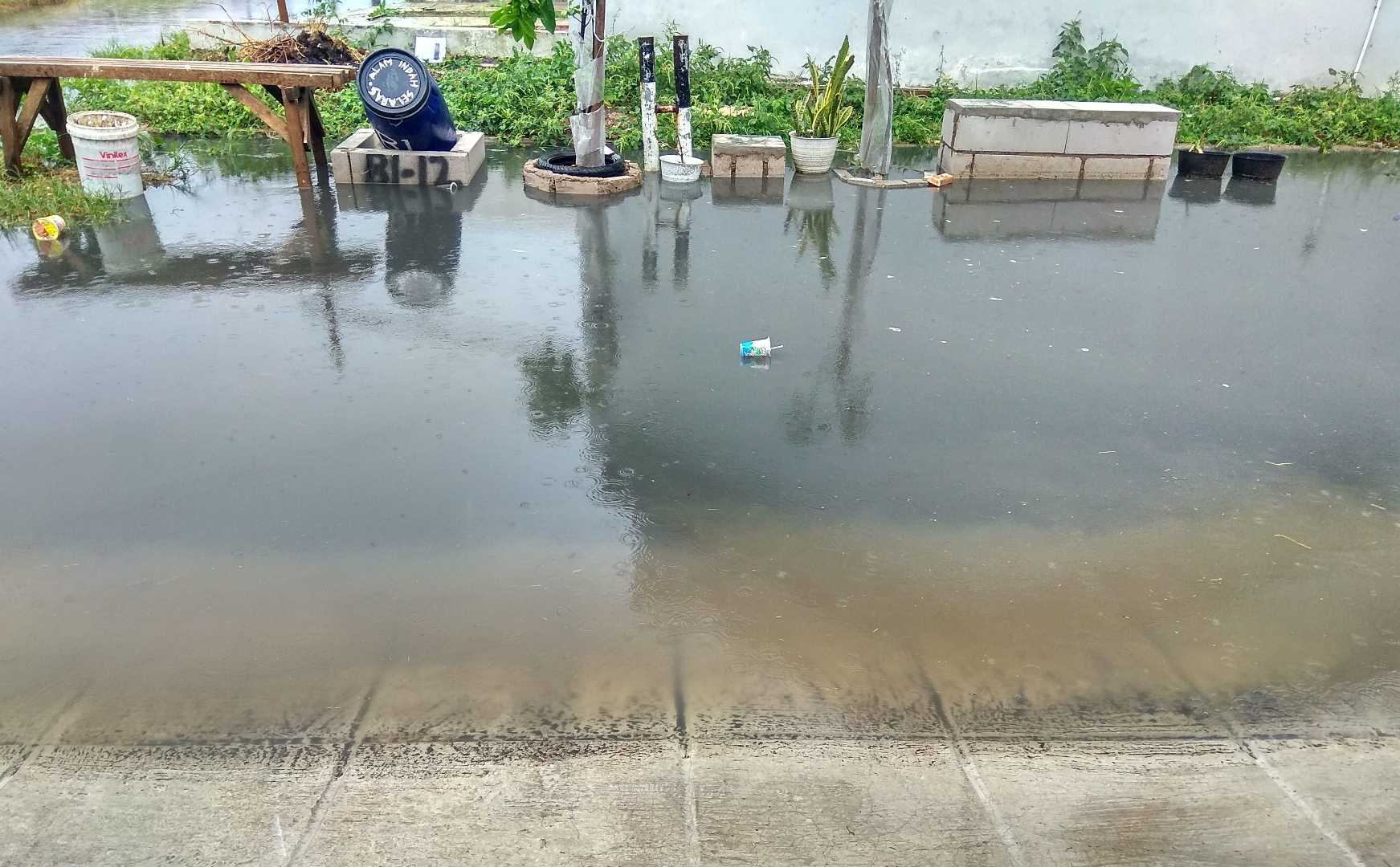 The flood water is murky black 