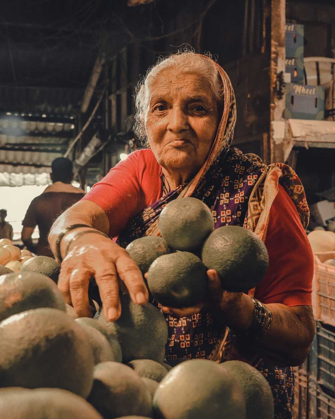 Old lady selling fruits and vegetables