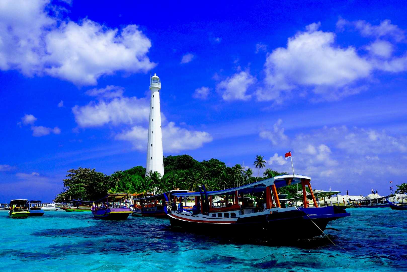 Sailing Boat Near Lighthouse on Lengkuas Island, Belitung