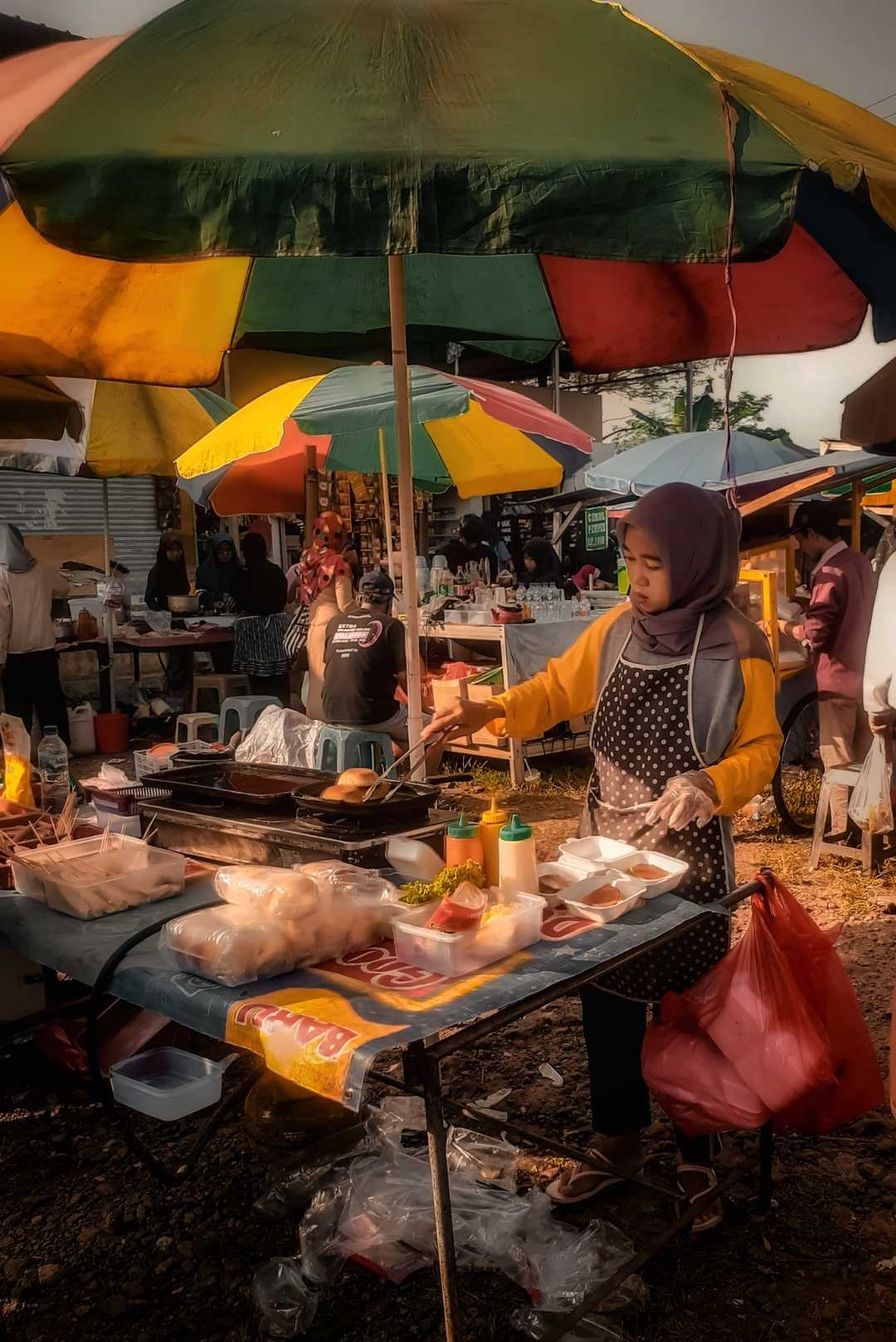 The lady selling burgers
