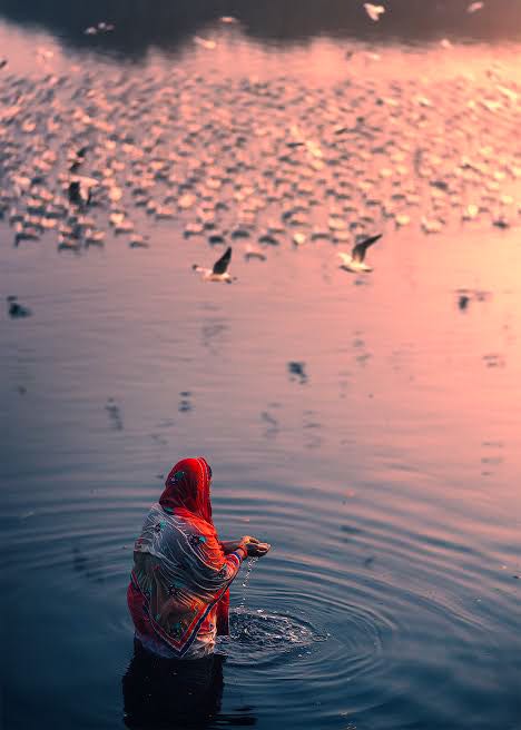 Offering water to Sun (Surya Arghya)