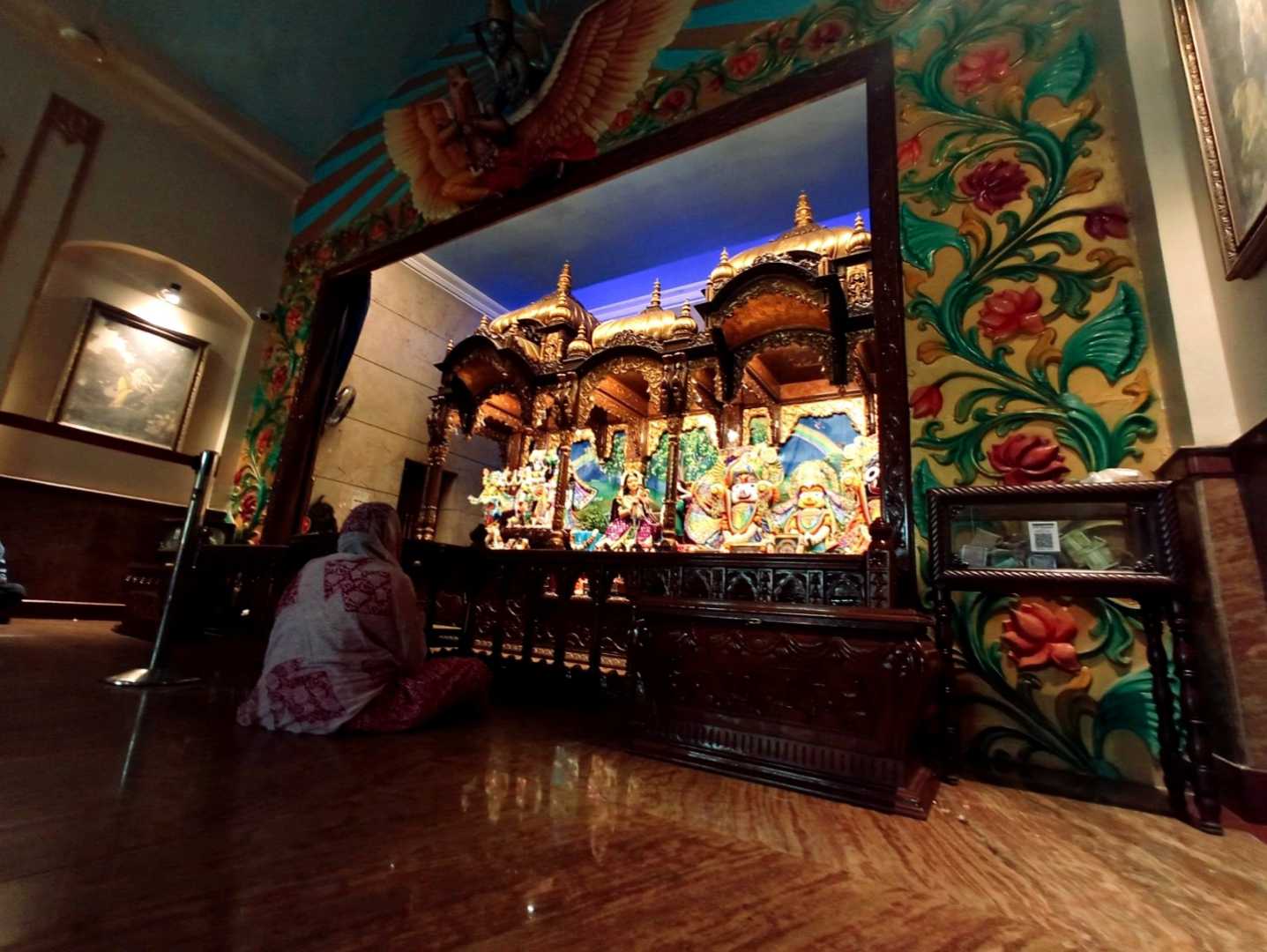 Worshipping at ISKCON Radha Govinda Temple 