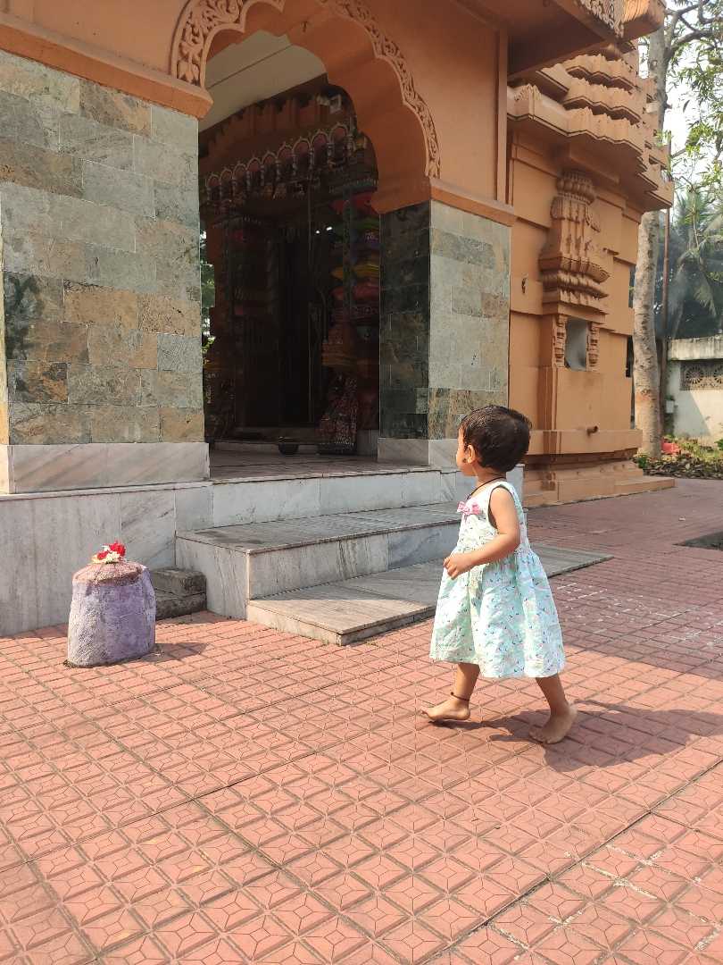 a baby girl in temple.